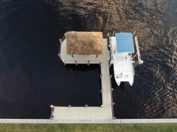 New Construction Dock with a tiki hut, boat lift and ample seating.