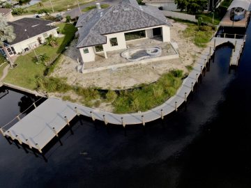 New Construction Dock on a curved lot with a boat lift and ample seating.