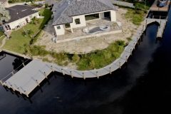 New Construction Dock on a curved lot with a boat lift and ample seating.