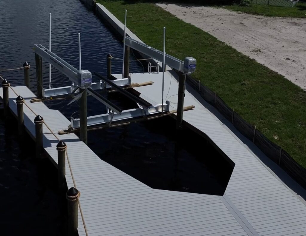 27,000 lb IMM Platinum boat lift installed inside a new Cape Coral dock
