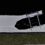 Top-down drone view of a new dock and IMM lift on a Cape Coral seawall