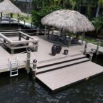 Custom Cape Coral dock with a tiki hut, viewing cutout, and lower paddle craft launch