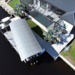 Aerial view of two boat lifts and a new dock addition in northwest Cape Coral