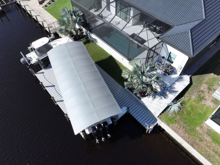 Aerial view of two boat lifts and a new dock addition in northwest Cape Coral