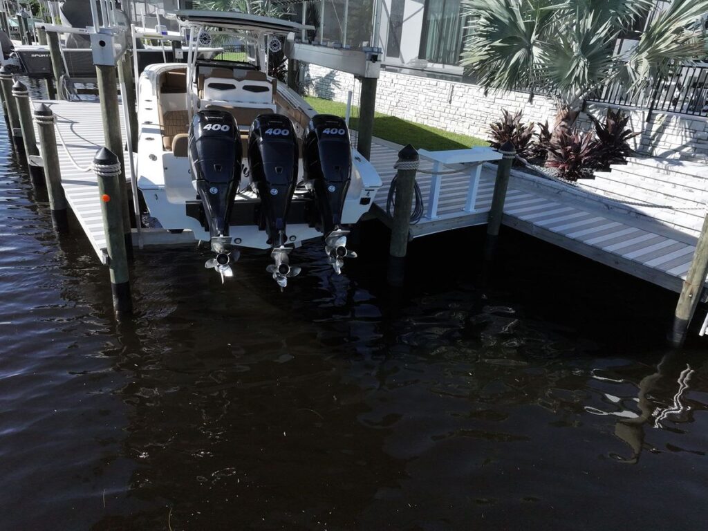 Fountain with triple Mercury Verados on a high speed boat lift in Cape Coral