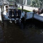 Fountain with triple Mercury Verados on a high speed boat lift in Cape Coral