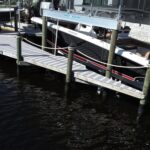 Two-tone WearDeck dock with two IMM boat lifts in northwest Cape Coral