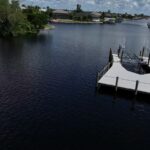 New WearDeck dock and boat lift seen from the canal in northwest Cape Coral