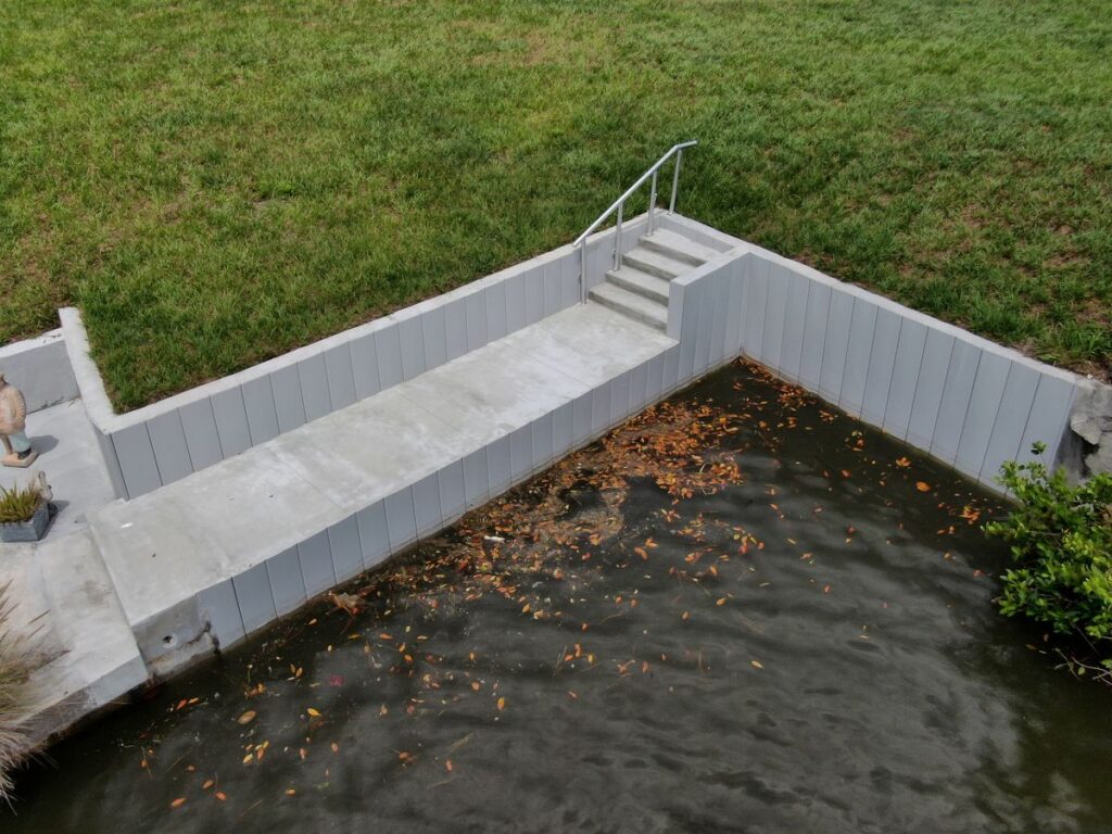 Finished concrete deck along the new seawall at the Overbrook site in Englewood