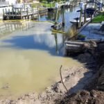 Excavated washout and turbidity barrier at the start of the Englewood seawall replacement