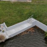 New Truline seawall with concrete deck and stairs at the end of a canal in Englewood, Sarasota County