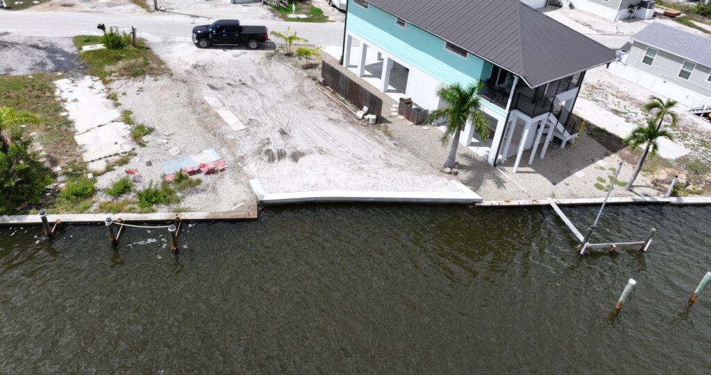 Aerial view of a canal lot on Fort Myers Beach after a 40 foot seawall replacement