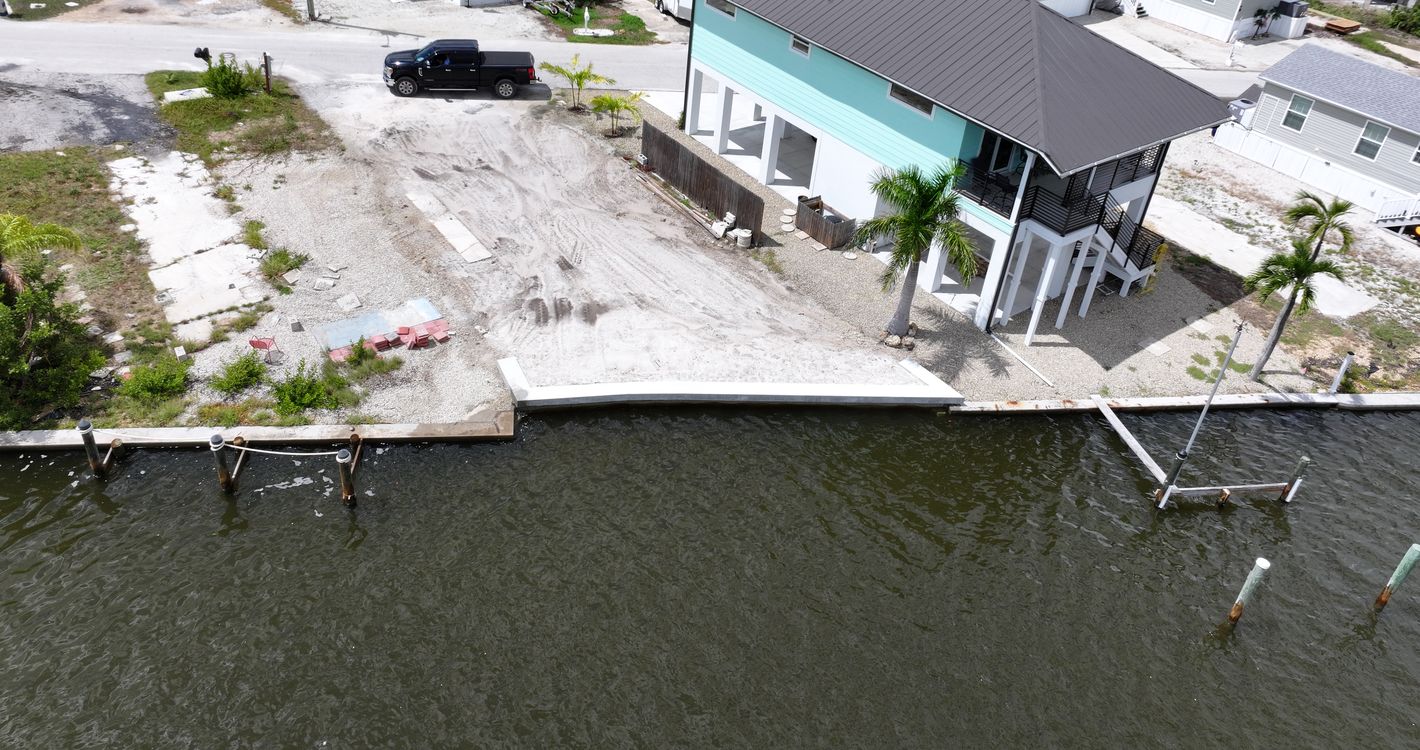 Aerial view of a canal lot on Fort Myers Beach after a 40 foot seawall replacement
