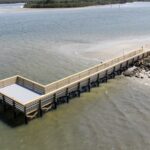 Finished Menard-May Park pier platform with grated decking and railings