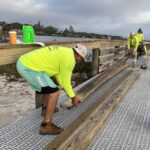 WB Williamson Bros. crew installing ThruFlow decking and railings on the Menard-May Park pier