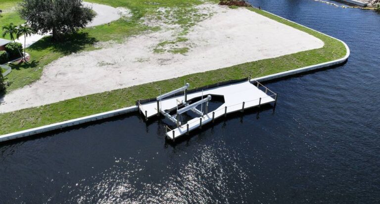 Aerial view of a new seawall and dock on a northwest Cape Coral corner lot
