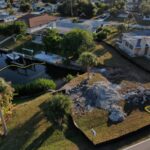 Aerial view of the storm washout at the end of an Englewood canal before repairs