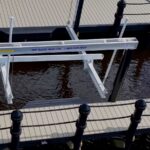 Boat lift and dock walkway with black double run rope rail in Cape Coral