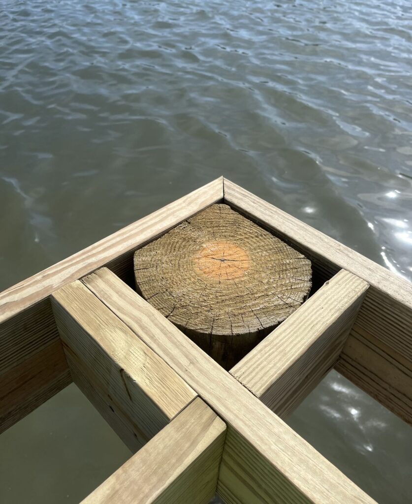 Timber piling and framing detail at the edge of the ThruFlow deck on the Veterans Memorial Park pier